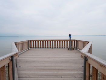 Pier over sea against sky