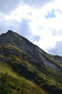 Low angle view of rock formations against sky