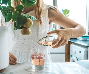 Midsection of woman having food at home