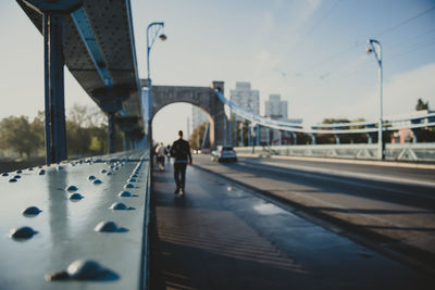 Rivet as a detail of an old suspension bridge and city road in perspective on a background