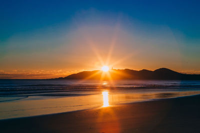 Scenic view of beach during sunset