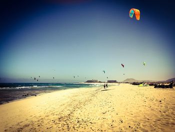 Scenic view of beach against clear sky