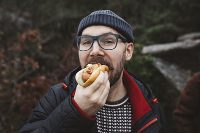 Man eating hotdog
