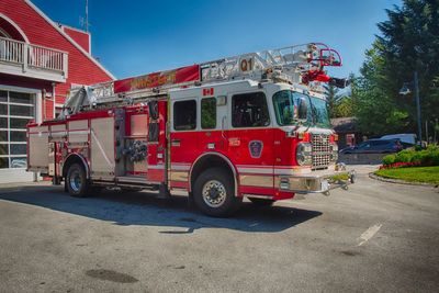 Vintage car on street in city against clear sky