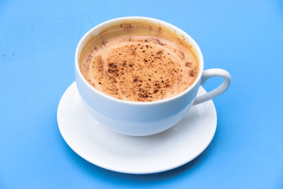 Close-up of coffee cup on table