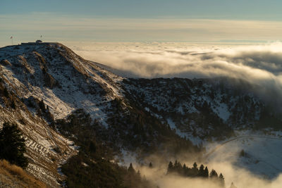 Scenic view of snowcapped mountains against sky during sunset