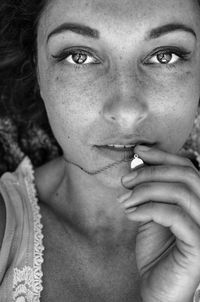 Close-up portrait of man smoking cigarette