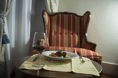 Wineglass with food on table