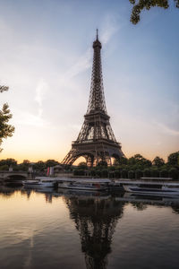 Eiffel tower against sky during sunset