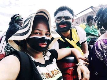 Portrait of young man and woman wearing mask