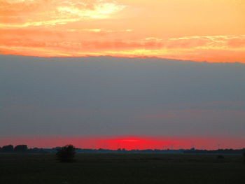 Scenic view of silhouette landscape against sky during sunset