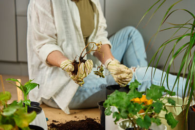 Midsection of woman holding bouquet