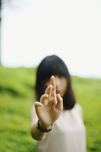 Portrait of man hand on field