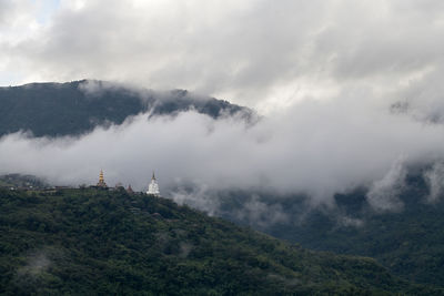 Phra that pha son kaew temple in the mist at khao kho, phetchabun, thailand