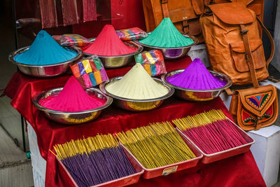 A selection of colored powders and incense for festivals and religious in fort kochin, kerala, india