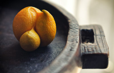 Close-up of orange fruit on table