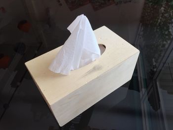 High angle view of facial tissue on table at restaurant