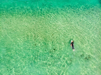 Aerial view of man in sea