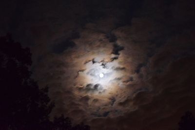 Low angle view of moon in sky at night