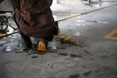 Low section of man working on street