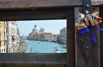 Panoramic view of wooden post in city against sky