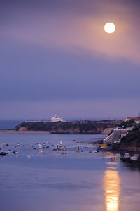 Scenic view of sea against sky at dawn