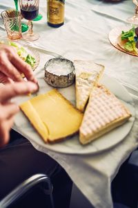 Close-up of person preparing food on table