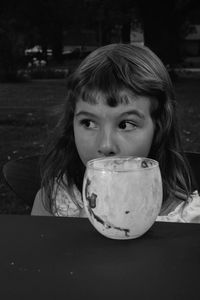 Girl with drink on table