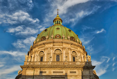 Low angle view of cathedral against cloudy sky