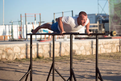 Man exercising at park