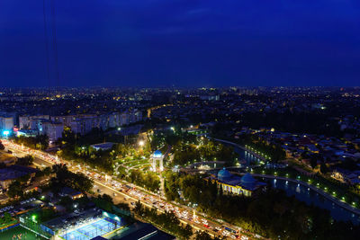 High angle view of illuminated buildings in city at night