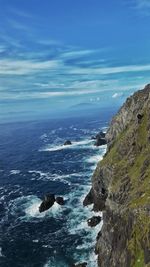 Scenic view of sea against blue sky