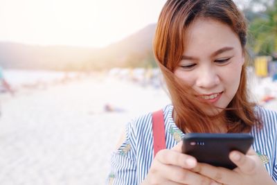 Young woman using mobile phone