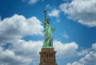 Low angle view of statue against cloudy sky