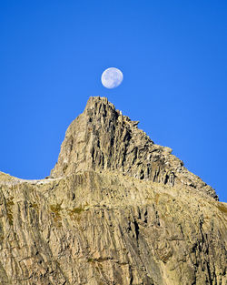 Low angle view of rock formation against sky