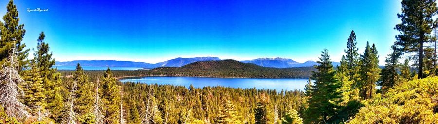 Scenic view of lake and mountains against clear sky