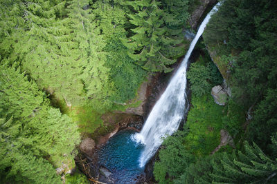 Vertical aerial view of the waterfalls produced by the avisio cavalese trentino river