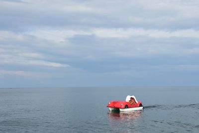 Man in boat on sea