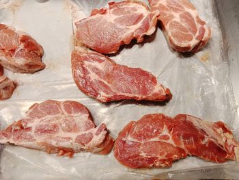 High angle view of meat on barbecue grill