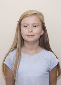 Portrait of beautiful young woman over white background