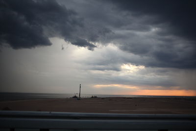 Scenic view of sea against sky at sunset