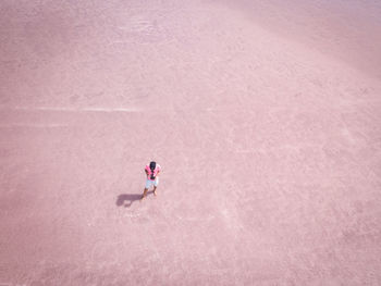 High angle view of man standing on footpath