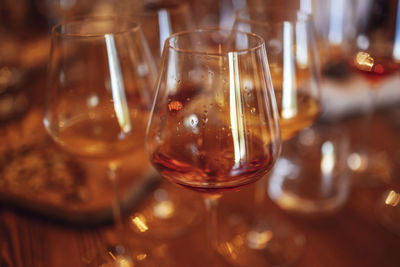 Close-up of wineglasses on table