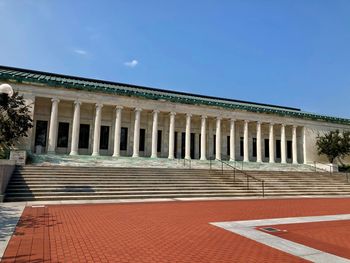 Low angle view of building against blue sky