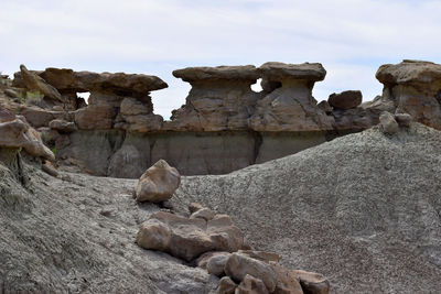 View of rocks on rock formation against sky