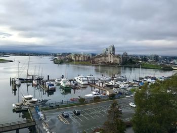 High angle view of harbor against cloudy sky