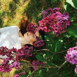 Young woman lying down on the grass