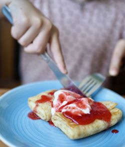 Midsection of person preparing food