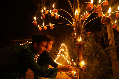 Man with fire crackers at night