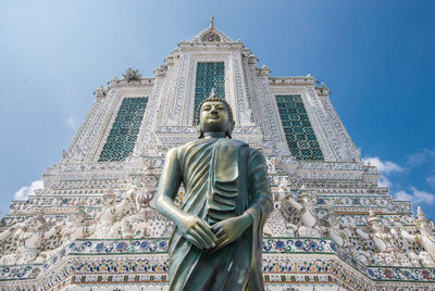 Low angle view of statue against building